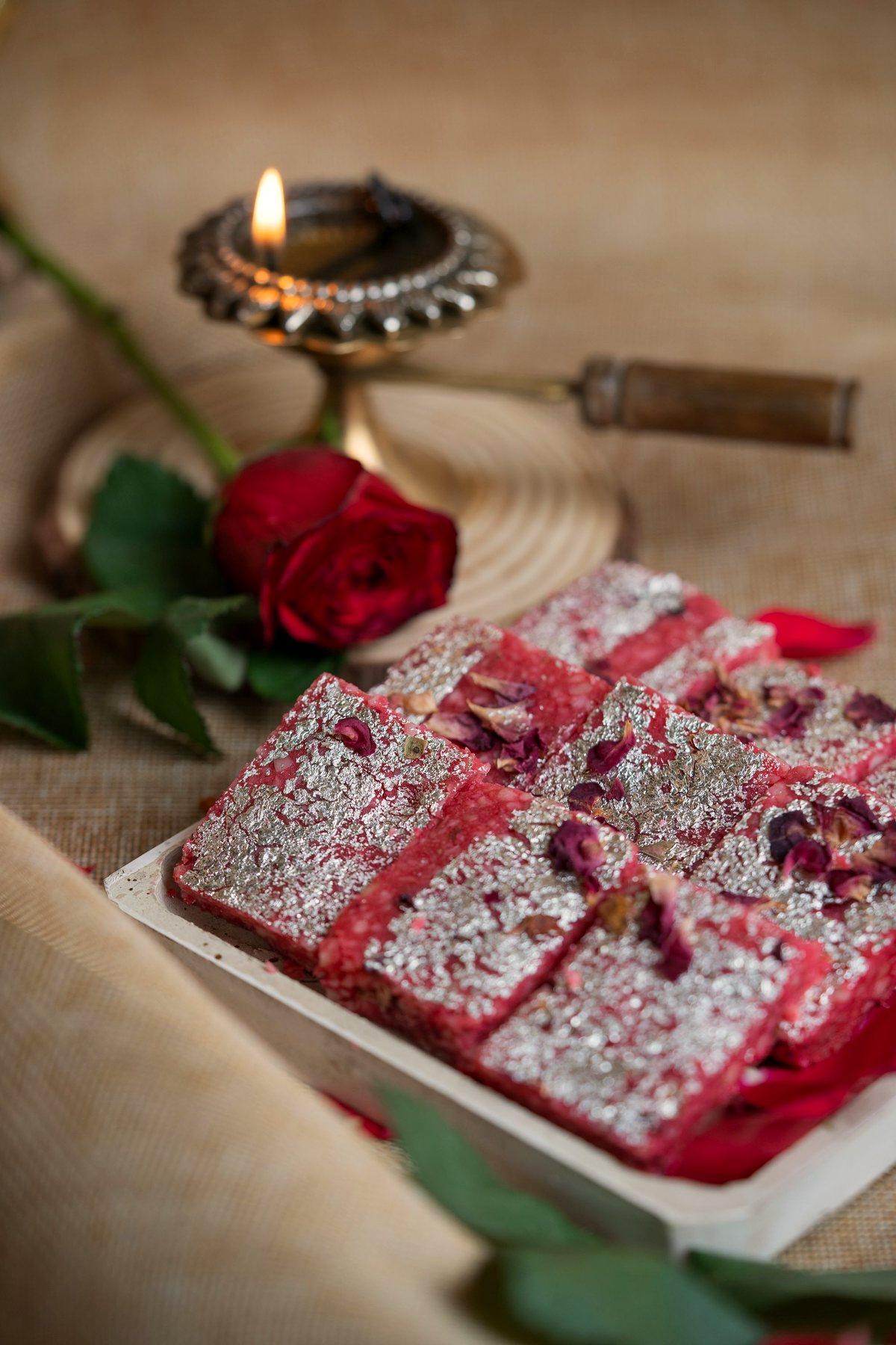 Pink rose barfi with silver leaf and rose petals